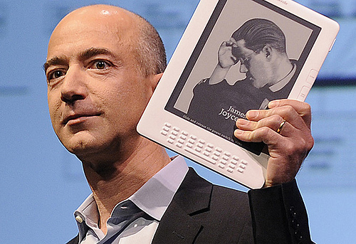 Amazon.com Founder and CEO, Jeff Bezos, holding a Kindle.